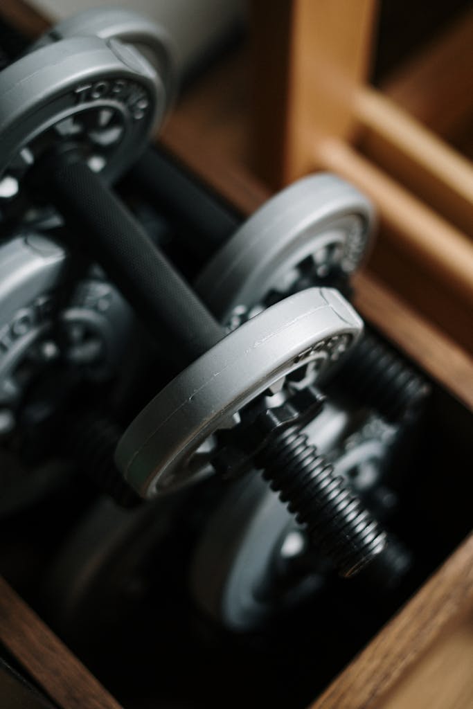 Ativafit adjustable dumbbell with push-pull dial system on storage base